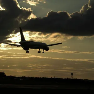 Boeing 757 landing in sunset