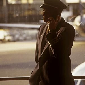 hoare boston logan airport captain onmobile phone in termainal