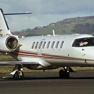Learjet 45 with pilot reading map in cockpit