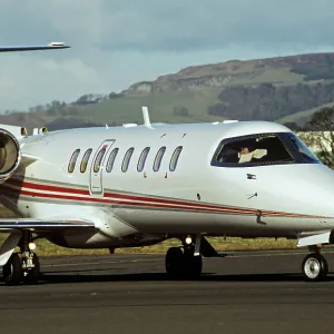 Learjet 45 with pilot reading map in cockpit