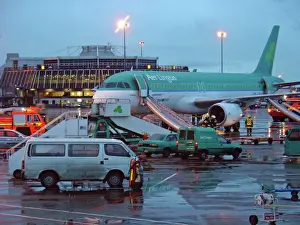 Airbus A320 Aer Lingus at Dubin Airport with evacuation slides deployed and fire service