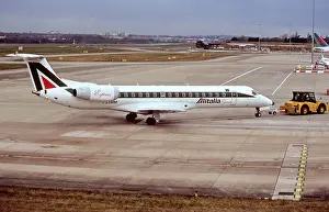 Alitalia Express Embraer ERJ145 on tow at Birmingham Airport UK