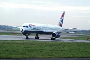 B. A 757; painted nose; taxing ;bright overcast day