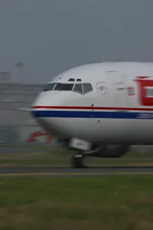 Boeing 737-400 taxying at airport with motion