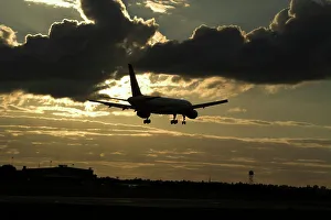 Boeing 757 landing in sunset