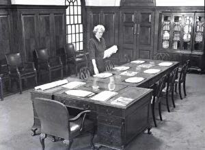 Flight Gallery: ecretary prepares a boardroom for a meeting, 1950 s