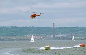 Helicopter being used to film power boat race