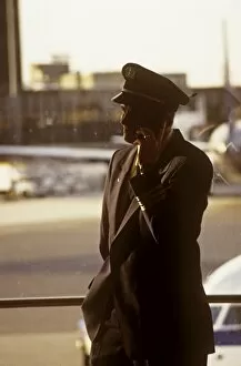 Flight Collection: hoare boston logan airport captain onmobile phone in termainal