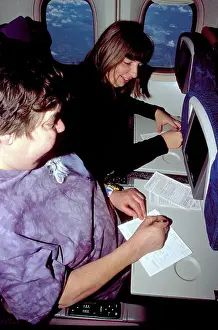 Interiors: filling in immigration forms on board aircraft