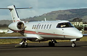 Learjet 45 with pilot reading map in cockpit