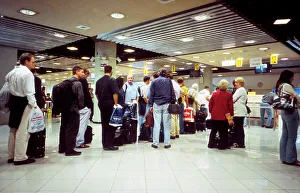 Passengers queue for visas