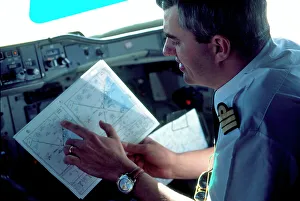Pilot looking at map