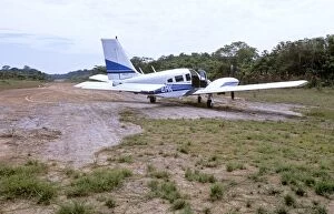 Images Dated 13th February 2006: Piper Seneca on dirt airstrip in Amazon jungle, South America