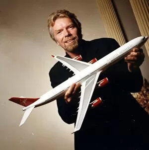 Branson Collection: Richard Branson holding model of the A340-600