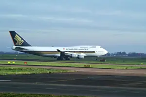 singapore airlines 747-412;manchester airport;taxing;bright and overcast;
